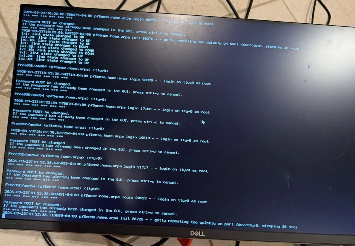 pfSense console on March 23rd, ix1 link state cycling DOWN and UP between getty login loops